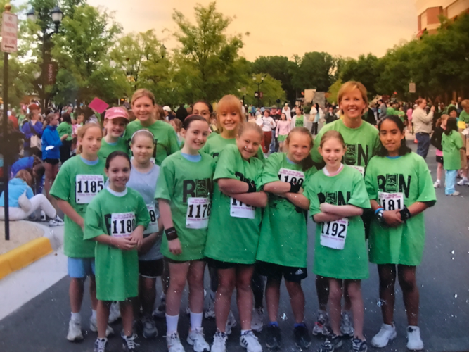 Group of girls posing for a picture at the 5K.